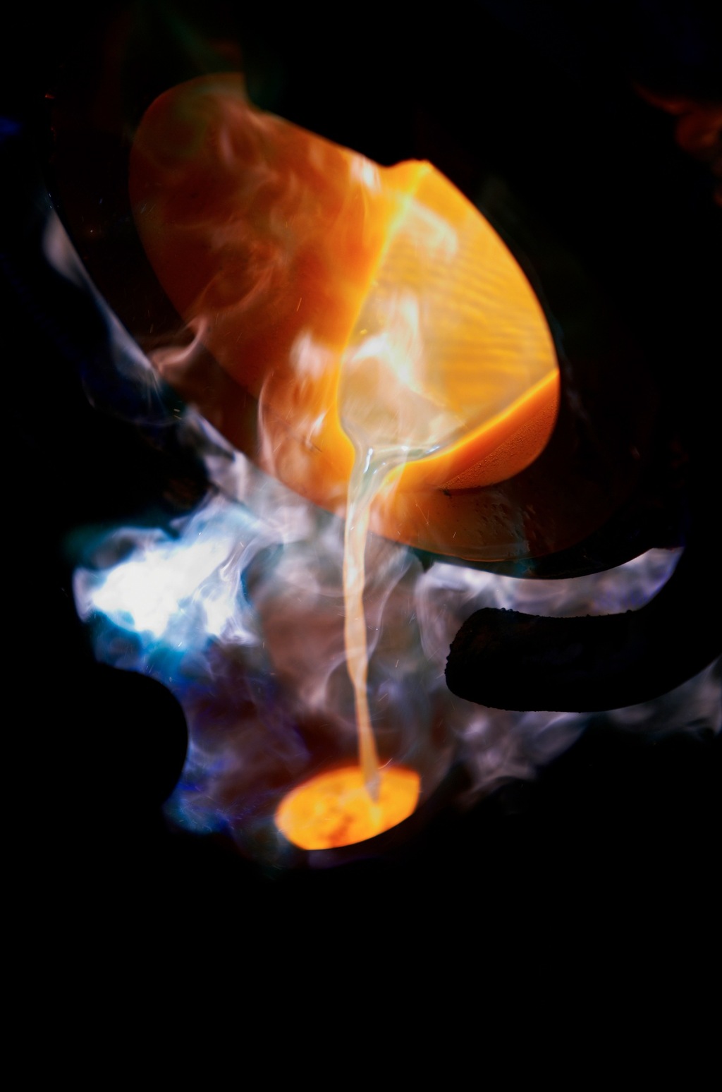 Molten gold being poured at Rolex's in-house foundry at Plan-les-Ouates, where the company casts its own gold alloys